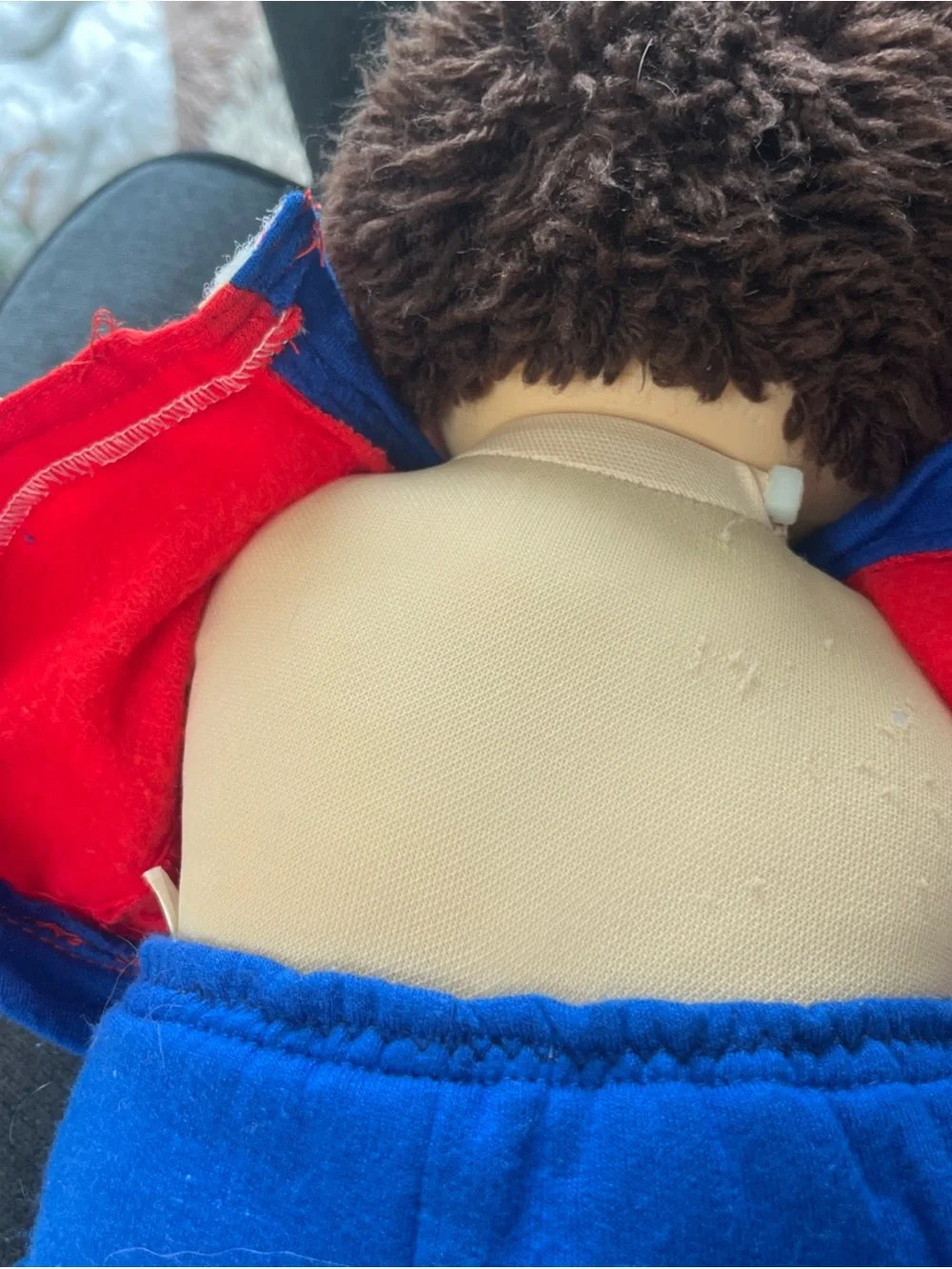 Cabbage Patch Kid with short clipped hair in sweats outfit